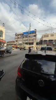 Occupation army vehicles roam the streets of downtown Jenin.