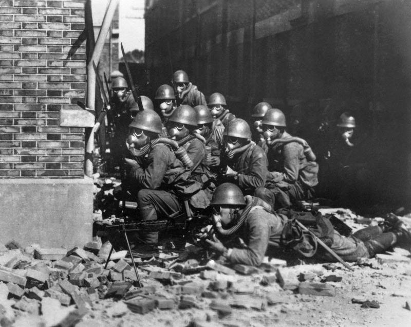 Japanese troops wearing gas masks and rubber gloves during a chemical attack, Second Battle of Shanghai, 1937Time Machine | Historical Photo