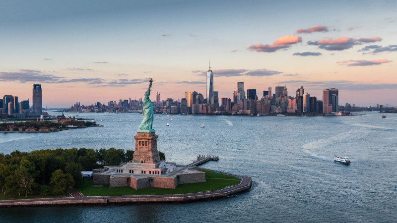 In unity and remembranceStatue of Liberty and Lower Manhattan, New York City (© Tetra Images/Getty Images)