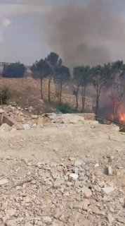 The scene of the town of Peron after a suspicious object, remnants of war, exploded near civilians picking olives.