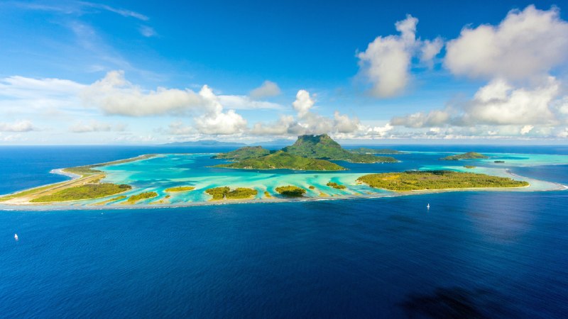 Born on fire, held by waterBora Bora and its lagoon, South Pacific, French Polynesia (© Frederick Millett/Shutterstock)