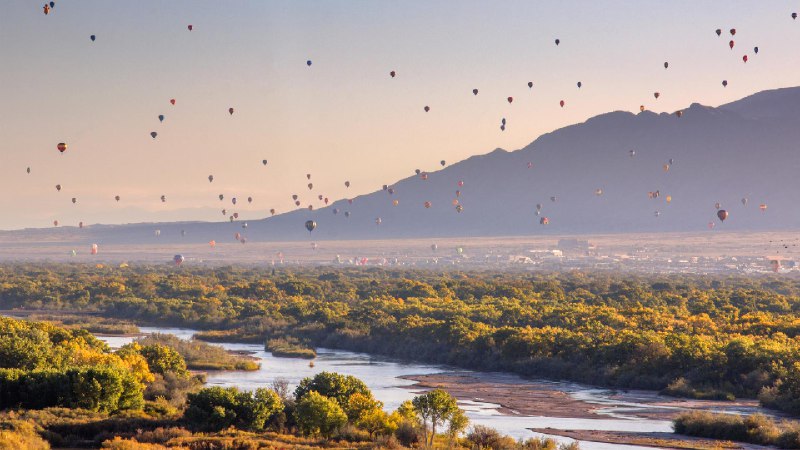 Hot air balloons over the Rio Grande, Albuquerque, New Mexico (© Jennifer MacCornack/Shutterstock)January 09, 2024 at 07:00AM