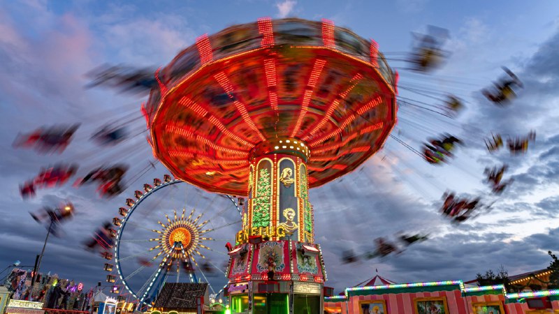A tale of brews and viewsSwing carousel at Oktoberfest, Munich, Germany (© LOOK-foto/Alamy)