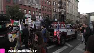 WATCH: A woman sobs on a Manhattan sidewalk as a pro-Palestinian march passes on the October 7th anniversary.
