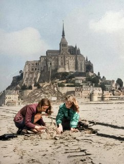 Travelers build a replica of the French medieval abbey of Mont Saint-Michel out of sand in the background, 1948.Time Machine | Historical Photo