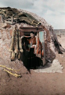 An Indian woman at the entrance to her home in Arizona. Photographer Clifton R. Adams, 1929.Time Machine | Historical Photo