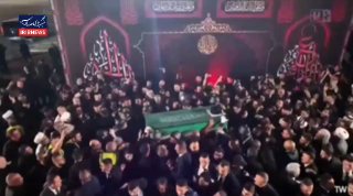 🎦 נוכחותו של הנשיא פז'קיאן בנמל התעופה נג'ף אשרף, במהלך הגעת גופת המנהיג ההרוג לעיראק