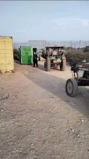 Dozens of farmers are still stuck in front of the agricultural gates in Kalkilia after they were suddenly closed by the occupation and prevented from reaching their lands behind the wall.