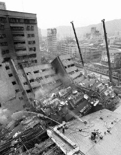 Rescue workers and firefighters search through the rubble of a destroyed hotel for victims after the Jiji earthquake in central Taiwan. Taipei, Republic of China, September 22, 1999.Time Machine | Historical Photo