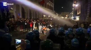Italian police are trying to disperse protesters in Rome using water cannons.
