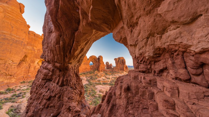 Underneath the archesDouble Arch seen through Cove Arch, Arches National Park, Utah (© Jeff Foott/Minden Pictures)