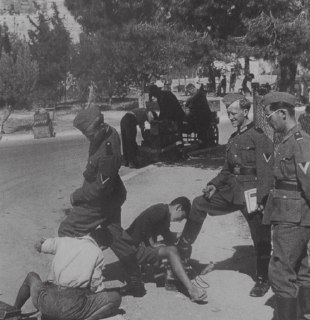 Teenagers polish the boots of Wehrmacht sergeants near the Acropolis in Athens.Time Machine | Historical Photo