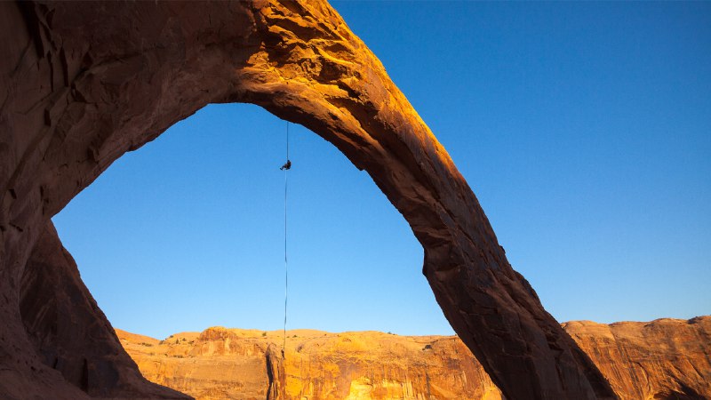 Earth's open secretA man rappels off Corona Arch near Moab, Utah (© Grant Ordelheide/TANDEM Stills + Motion)