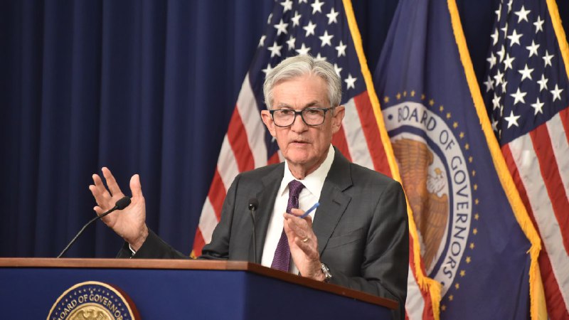 Fed leaves rates on hold, warns of 