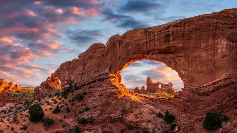 A work of archEvening light over North Window with Turret Arch in the distance, Arches National Park, Utah (© Anthony Heflin/Shutterstock)