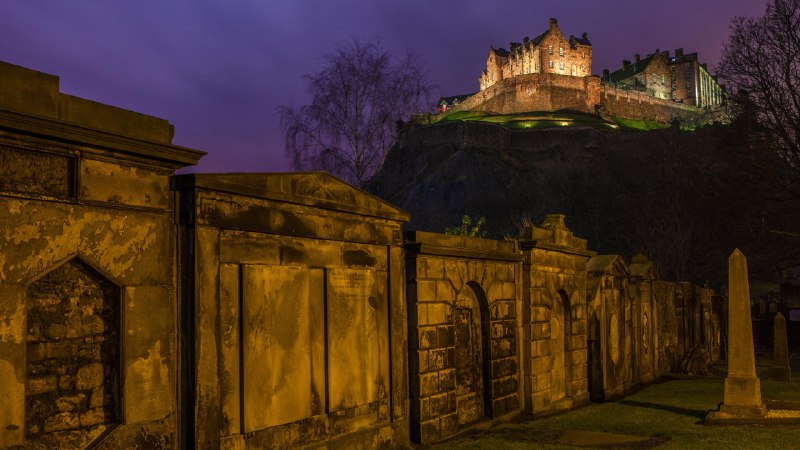A haunting historyView of Edinburgh Castle from a churchyard in Scotland (© Chris Dorney/Alamy)