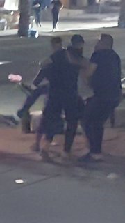 The moment when a young man was led away after being shot by an Israeli drone on "Twenty" Street, east of the Nuseirat refugee camp, in the center of the Gaza Strip.