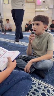 The boy, Fathi Muhammad Jitawi, is the first boy to recite 10 parts of the Holy Quran in one session, as part of the Quran reading day activities "Nuhbat al-Hufaz 3" in Tulkarem.