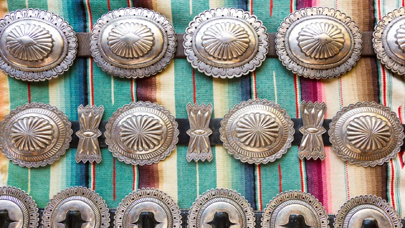 Wear your heritageCollection of silver Native American concho belts, Santa Fe, New Mexico (© julien mcroberts/Shutterstock)