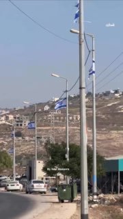 Settlers hang Israeli flags across streets in Jenin region