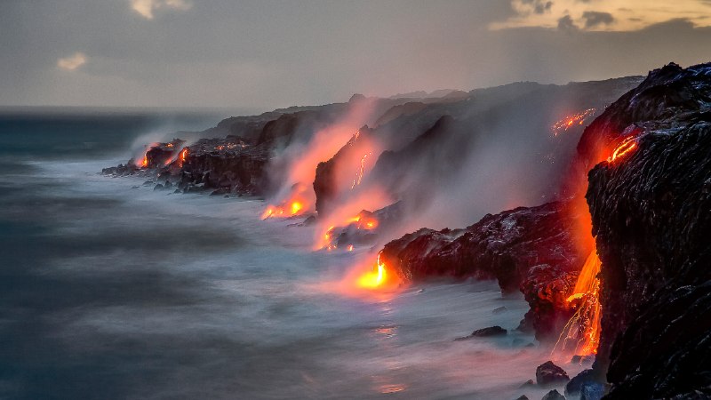 The power of KīlaueaA series of lava flows spill into the ocean, Big Island, Hawaii (© Ken McCurdy/Getty Images)