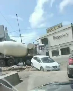 Floods shut down this car on McCalls Road and it fell into a big hole!