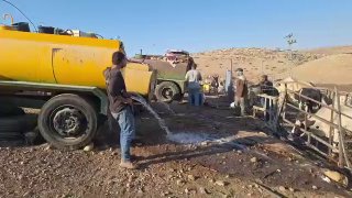 Settler empties Palestinian water tanks at gunpoint in Jordan Valley