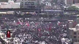 🎦 המכונית הנושאת את גופתו של מנהיג המהפכה המעונה הגיעה לכיכר ת'ורת אל-אשרין בנג'ף