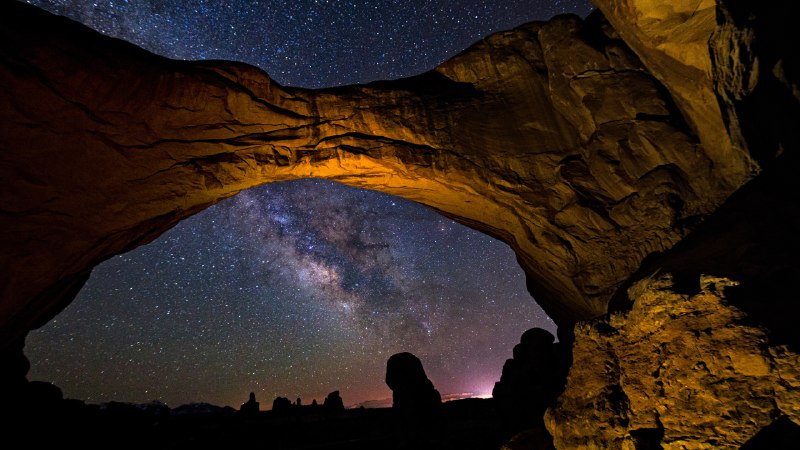 Let's celebrate the cosmosThe Milky Way framed by Double Arch in Arches National Park, Utah (© Adventure_Photo/Getty Images)
