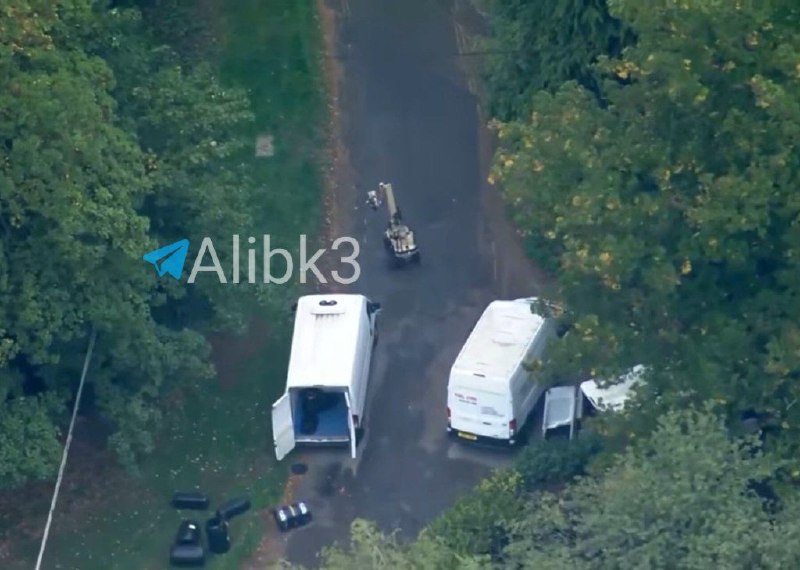 British security forces try to dispose of explosives near RAF Fairford, where a small bomb disposal robot can be seen working next to several trucks, possibly loaded with explosives, which were headed for the air base where US B-1B and B-52H bombers are stationed.