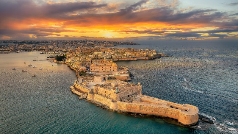 A city written in centuriesSyracuse at sunset, Sicily, Italy (© Balate Dorin/Getty Images)