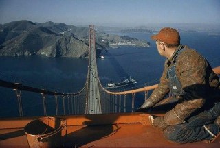 A worker paints the Golden Gate Bridge, 1956.Time Machine | Historical Photo