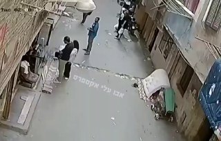 Egypt - A-Lawa' area in Cairo - An alert citizen with particularly good instincts manages to catch a child who fell from a high place in a building and was restrained by a clothesline.