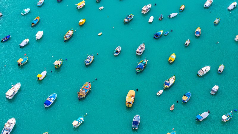 Bright boats, timeless traditionsColorful boats in Marsaxlokk Harbor, Malta (© Klubovy/Getty Images)