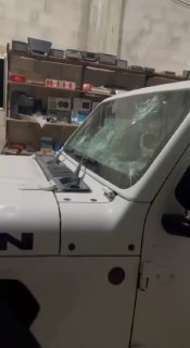 Settlers destroy Palestinian vehicles during their attack on the village of al-Laban al-Sharqiya, south of Nablus.