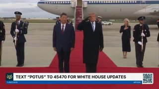 Flash: A US Air Force B-1 roars over Trump and Xi on the runway.