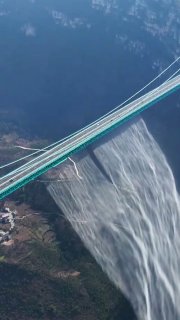 The Huajiang Canyon Bridge in China, the world's highest bridge at 625 meters, releasing a massive wall of water.The bridge features a record-breaking artificial waterfall system that transforms excess mountain groundwater into a massive, 300-meter-wide cascade plummeting into the gorge.Did you know? 🎓