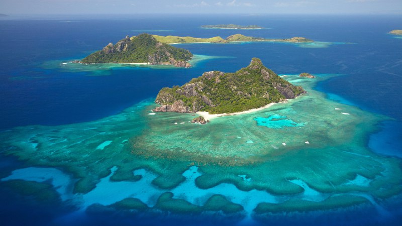 A reef of reflectionCoral reef surrounding the island of Monuriki, Mamanuca Islands, Fiji (© David Wall/SuperStock)