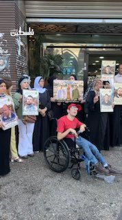 View a solidarity stand in the center of Nablus city, in support of the prisoners and in memory of the massacre at "Sabra and Shatila".