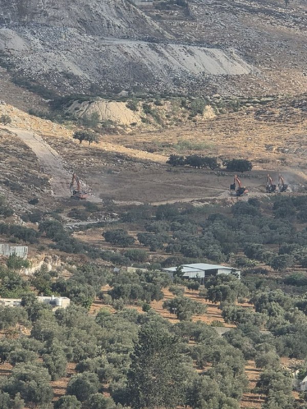 Settlers begin to dig Palestinian lands in the Zibda area of Niliin, Ramallah district.