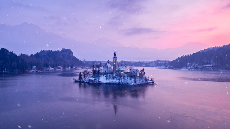 Icy reflections and snow-dusted peaksLake Bled, Slovenia (© Kesu01/Getty Images)