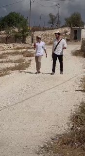 Armed settlers revel in the surroundings of the "Al-Marajm" kherbat near the town of Duma, south of Nablus.