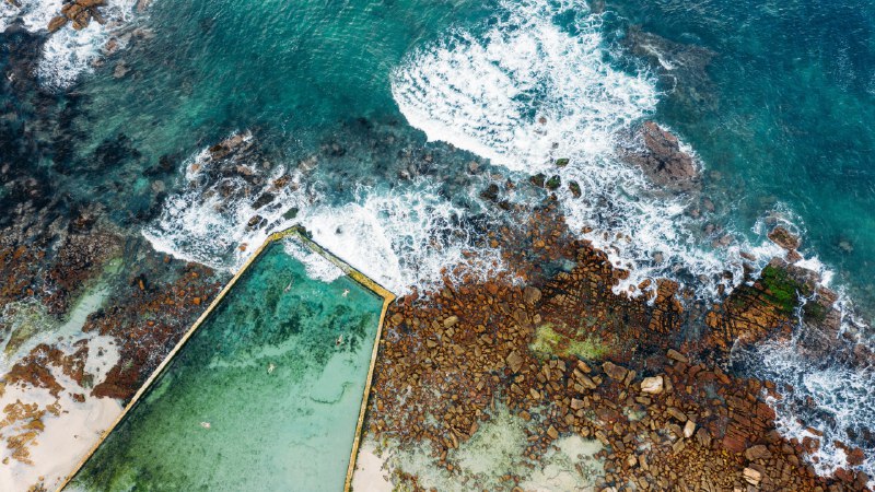 Swimming with the tideSt. James Tidal Pool, Cape Town, South Africa (© AmazingAerialAgency/Adobe)