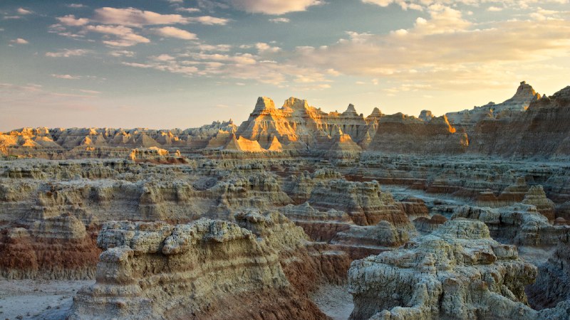 Epic sunsets and ancient secretsSunset over Badlands National Park, South Dakota (© Petr Bednarik/Danita Delimont/Alamy)