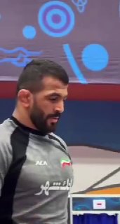 חימום של חסן יזדאני לפני תחילת הזדמנות נוספת באליפות העולם בהיאבקות בסגנון חופשי - קזחסטן