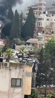 מדירת מגורים עולות שריפות לאחר שפוצצה על ידי כוחות הכיבוש סמוך לבית החולים הלאומי