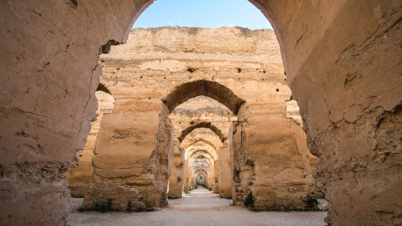 Arches of a bygone eraHeri es-Swani in Meknes, Morocco (© Calin Stan/Shutterstock)