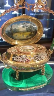 This antique egg-shaped object is studded with diamonds and has the sound of birds chirping.