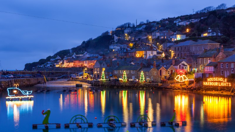 The holidays continueChristmas lights at Mousehole Harbour, Cornwall, England (© ianwool/Getty Images)