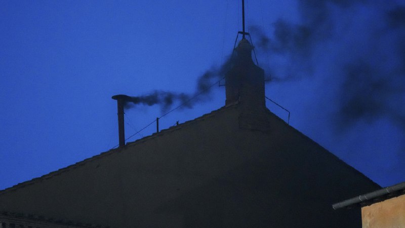Black smoke rises from the Sistine Chapel as cardinals cast an unsuccessful first vote